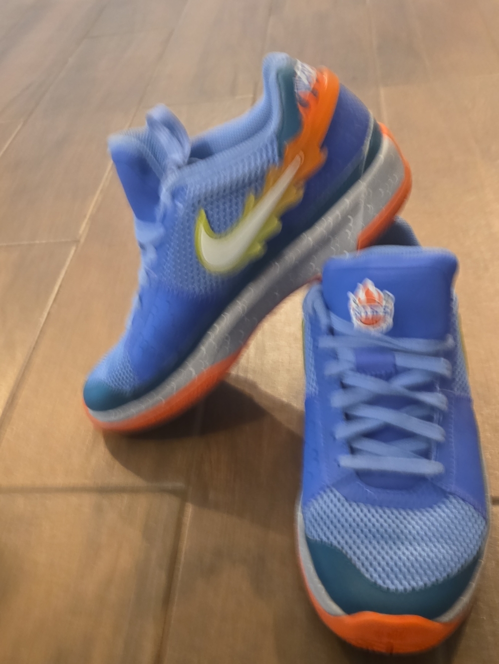 Nike Kids Blue Sneakers with Orange and Yellow Accents